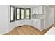 Charming kitchen nook with bay window and black and white backsplash at 609 Delray Dr, Indianapolis, IN 46241