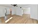 Open-concept living area with hardwood floors and generous space, ideal for modern living and entertaining at 609 Delray Dr, Indianapolis, IN 46241