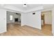 Bright living room featuring wood floors and an open fireplace at 609 Delray Dr, Indianapolis, IN 46241
