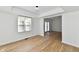 Bright living room with wood floors and french doors leading to the backyard at 609 Delray Dr, Indianapolis, IN 46241