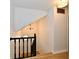 Bright stairwell with modern lighting, hardwood floors and neutral paint at 609 Delray Dr, Indianapolis, IN 46241