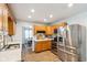 Well-lit kitchen featuring hardwood floors, stainless steel appliances, and ample counter space at 6123 W 46Th St, Indianapolis, IN 46254