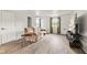 Cozy living room with hardwood floors, comfortable seating, and natural light from the windows at 6123 W 46Th St, Indianapolis, IN 46254