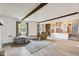 Bright, open living space with a clear view of the kitchen, featuring hardwood flooring and natural light at 6123 W 46Th St, Indianapolis, IN 46254