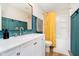 This bathroom features blue wainscotting, a single sink vanity, and a shower-tub combo with yellow curtain at 6144 Black Oaks Way, Indianapolis, IN 46237