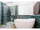 This bathroom boasts a soaking tub, standing shower, sleek tiling, modern fixtures, and window with blind at 6144 Black Oaks Way, Indianapolis, IN 46237