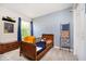 This cozy bedroom features blue accents, a vintage bed, and whimsical decor, creating a playful atmosphere at 6144 Black Oaks Way, Indianapolis, IN 46237