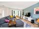 Cozy living room with modern furnishings, including a comfortable gray sofa and bright area rug at 6144 Black Oaks Way, Indianapolis, IN 46237