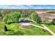Picturesque aerial view of a charming home with green lawn, and beautiful mature trees on a sunny day at 6149 W Olive Branch Rd, Greenwood, IN 46143