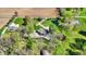 Aerial view of a luxury home with a pool, pond, large yard, and mature trees at 6149 W Olive Branch Rd, Greenwood, IN 46143