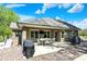 Outdoor patio with dining furniture, grill, and landscaped backyard at 6149 W Olive Branch Rd, Greenwood, IN 46143