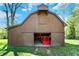 Expansive barn featuring large doors, perfect for equipment storage and projects at 6149 W Olive Branch Rd, Greenwood, IN 46143