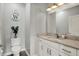 Powder room featuring a large mirror, modern fixtures and a decorative wall hanging at 6149 W Olive Branch Rd, Greenwood, IN 46143