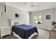 Comfortable bedroom with natural light, a ceiling fan, and a cozy bed for a peaceful retreat at 6149 W Olive Branch Rd, Greenwood, IN 46143