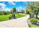 View of long driveway leading to beautiful home on expansive lot with lush green lawn at 6149 W Olive Branch Rd, Greenwood, IN 46143