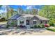 Beautiful brick home with stone accents and professionally landscaped front yard at 6149 W Olive Branch Rd, Greenwood, IN 46143