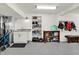 Attached garage featuring a sink, vanity, shelving, and workspace at 6149 W Olive Branch Rd, Greenwood, IN 46143