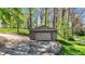 Detached garage with concrete driveway offers ample parking and storage space at 6149 W Olive Branch Rd, Greenwood, IN 46143
