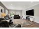 Bright living room with hardwood floors, recessed lighting, and fireplace at 6149 W Olive Branch Rd, Greenwood, IN 46143