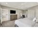 Light filled main bedroom featuring a ceiling fan, dresser with TV, and closet with ensuite bathroom access at 6149 W Olive Branch Rd, Greenwood, IN 46143