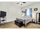 Neutral-toned bedroom features plush carpet, a ceiling fan, and comfortable decor at 6257 Old Barn Ct, Indianapolis, IN 46268