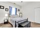 Well-lit bedroom with plush carpet, ceiling fan, and a comfy bed frame at 6257 Old Barn Ct, Indianapolis, IN 46268