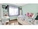 Bedroom featuring bright walls, plush toys, and a built-in desk at 6257 Old Barn Ct, Indianapolis, IN 46268
