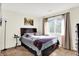 Cozy bedroom with neutral walls, a window, and dark furniture at 6257 Old Barn Ct, Indianapolis, IN 46268