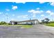 Community center with swimming pool slide, parking, and architectural details on a sunny day at 6257 Old Barn Ct, Indianapolis, IN 46268
