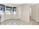 Sunny kitchen nook with ceramic tile floors and natural lighting with checkered curtains at 6257 Old Barn Ct, Indianapolis, IN 46268