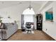 Well-lit living room with vaulted ceiling, neutral decor, and comfortable furnishings offers a cozy and inviting atmosphere at 6257 Old Barn Ct, Indianapolis, IN 46268