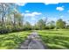 Landscaped walkway through the park, ideal for peaceful strolls and outdoor recreation at 6257 Old Barn Ct, Indianapolis, IN 46268