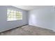 Bedroom featuring a window and neutral carpet at 6638 Sunbury Dr, Indianapolis, IN 46241