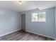Renovated bedroom featuring modern flooring, fresh paint, and a bright window for natural light at 6638 Sunbury Dr, Indianapolis, IN 46241