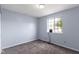 Cozy bedroom features a window and neutral carpet at 6638 Sunbury Dr, Indianapolis, IN 46241