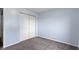 Bedroom with a double closet and soft neutral carpet at 6638 Sunbury Dr, Indianapolis, IN 46241