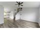 Spacious living room with kitchen, staircase and laminate flooring at 6638 Sunbury Dr, Indianapolis, IN 46241