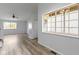 Open-concept living area with natural light, laminate flooring, and neutral paint palette throughout at 6638 Sunbury Dr, Indianapolis, IN 46241