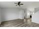 Bright living room with hardwood floors and ceiling fan at 6638 Sunbury Dr, Indianapolis, IN 46241