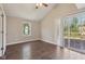 View of a bedroom featuring a sliding door leading to the home's deck and backyard at 7002 N Ralston Ave, Indianapolis, IN 46220