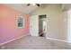A bright bedroom showcases carpet floors, a neutral color scheme, and a window at 7002 N Ralston Ave, Indianapolis, IN 46220