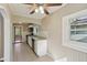 Bright kitchen with white cabinets, granite countertops, tile floors and view of the breakfast nook at 7002 N Ralston Ave, Indianapolis, IN 46220