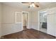 This charming living room offers wood floors, natural light, and a ceiling fan at 7002 N Ralston Ave, Indianapolis, IN 46220