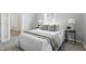 Bright bedroom features a comfortable bed, stylish side tables, and fresh, neutral decor at 717 S A St, Elwood, IN 46036