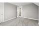 Empty bedroom offers fresh carpet, and is ready to be transformed into a personalized retreat at 717 S A St, Elwood, IN 46036