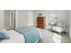 Comfortable bedroom with natural light, offering a calming space with a chair and decor at 717 S A St, Elwood, IN 46036