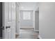 Bright hallway with wood-look floors and fresh, white paint showcasing the home's interior at 717 S A St, Elwood, IN 46036