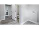 Hallway leads to a bathroom with laundry hookups for easy convenience in this lovely home at 717 S A St, Elwood, IN 46036