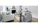 Bright living room featuring modern decor, fresh paint, fireplace, and lots of seating at 717 S A St, Elwood, IN 46036