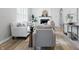 Bright living room featuring modern decor, fresh paint, fireplace, and lots of seating at 717 S A St, Elwood, IN 46036